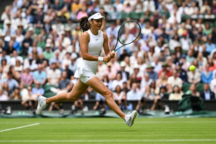 Tennis player running for a forehand on grass, Wimbledon 2024