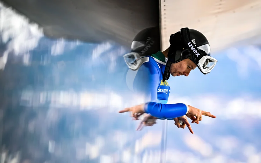 Ski jumper upside down, close-up of helmet and goggles