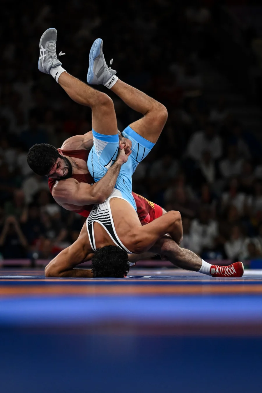 Wrestlers mid-throw at the Paris 2024 Olympic Games