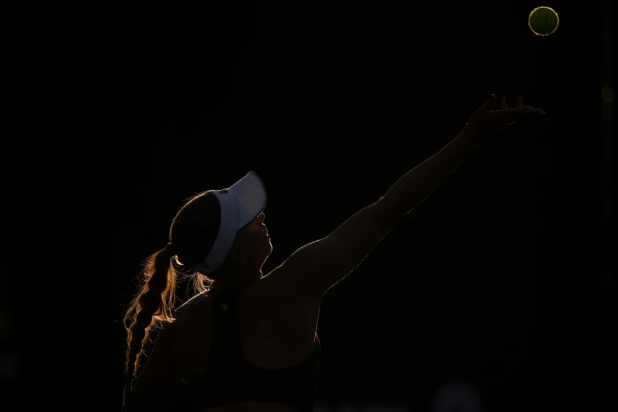 Tennis player serving in silhouette, Australian Open 2026